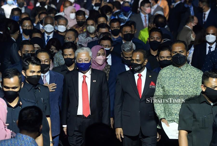 Prime Minister Datuk Seri Ismail Sabri Yaakob accompanied by Human Resources Minister Datuk Seri M. Saravanan arrive at the launch of the HRD Corp brand and one-stop platform for National Skills Programme at the Kuala Lumpur Convention Centre. - BERNAMA PIC