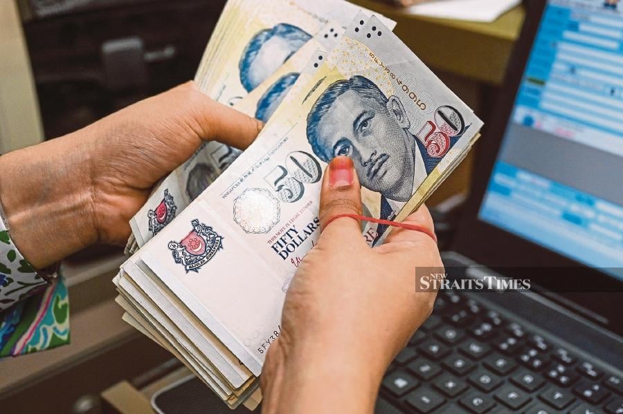 UPDATED - Ringgit hits new all-time low against Singapore dollar ...