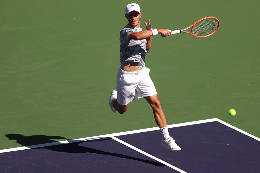 Diego Schwartzman of Argentina plays a forehand shot against Cameron Norrie of Great Britain during their match on Day 11 of the BNP Paribas Open on October 14, 2021 in Indian Wells, California. - AFP PIC