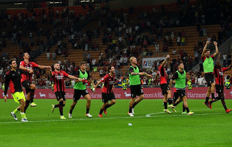 AC Milan players celebrate after winning 2-0 against Lazio at The San Siro Stadium in Milan, on September 12. - AFP PIC
