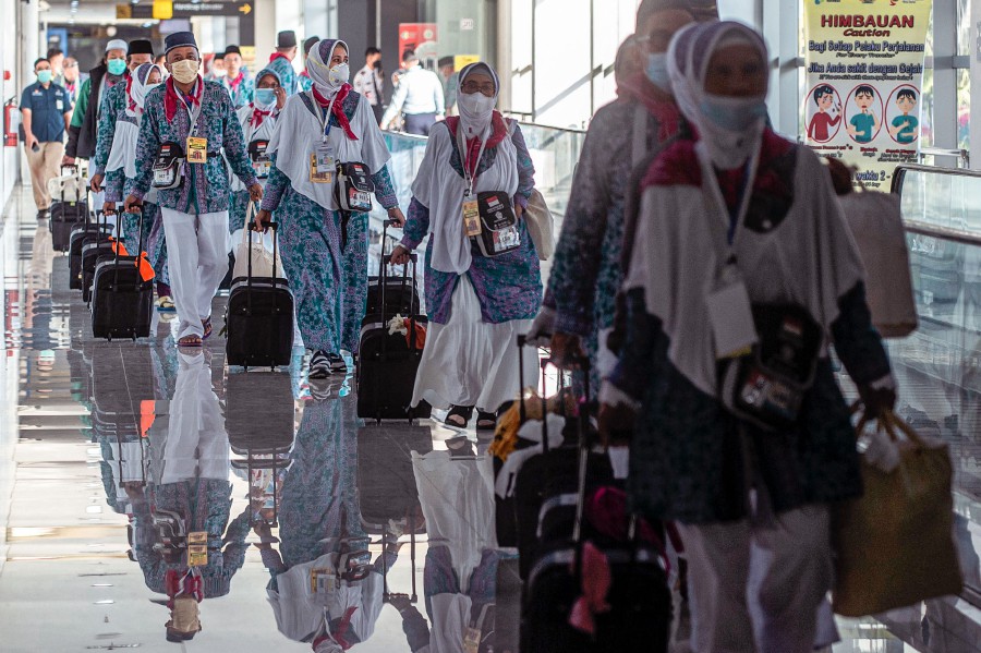 Indonesian pilgrims prepare to depart from Juanda International Airport in Surabaya on June 4, 2022, for the first time since the absence of the pilgrimage to Makkah in Saudi Arabia for several years during the Covid-19 coronavirus pandemic. -AFP PIC