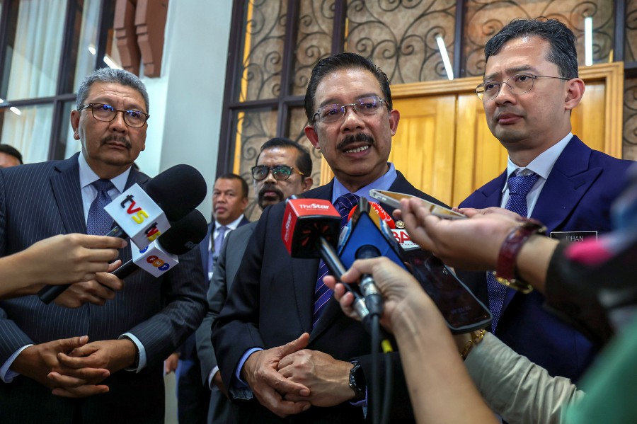 Chief Secretary to the Government Tan Sri Mohd Zuki Ali (centre) speaks to reporters after the ceremony at Puspanitapuri in Putrajaya. - BERNAMA PIC
