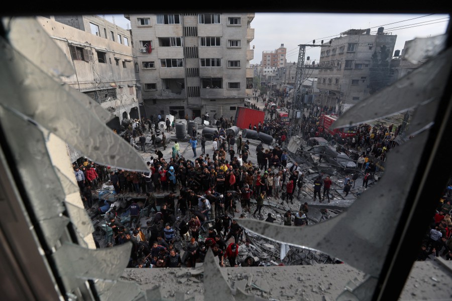 Palestinians gather at the site of an Israeli strike on a house, amid the ongoing conflict between Israel and the Hamas, in Rafah, in the southern Gaza Strip. - REUTERS PIC