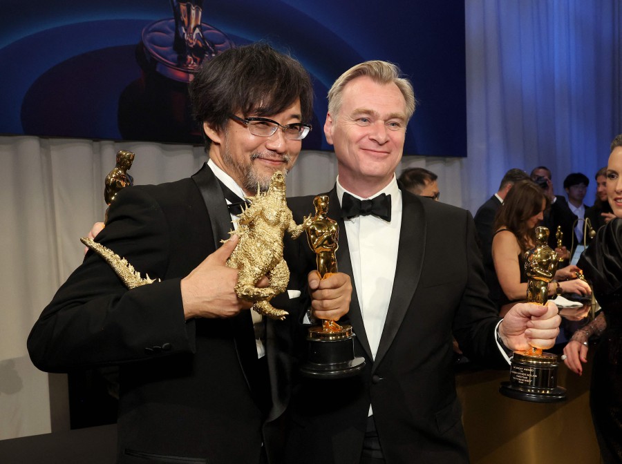 (L-R) Takashi Yamazaki, winner of Best Visual Effects for "Godzilla Minus One", and Christopher Nolan, winner of Best Director for "Oppenheimer", attend the Governors Ball during the 96th Annual Academy Awards at Dolby Theatre in Hollywood, California. - AFP PIC