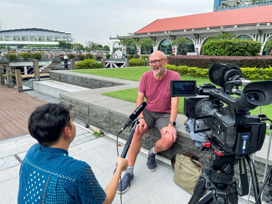 British citizen Andrew Davies, 54, a passenger on the Singapore Airlines flight SQ321, which was diverted to Bangkok, Thailand, after encountering severe turbulence en route from London, Britain, to Singapore, attends an interview with Reuters in Singapore. - REUTERS PIC
