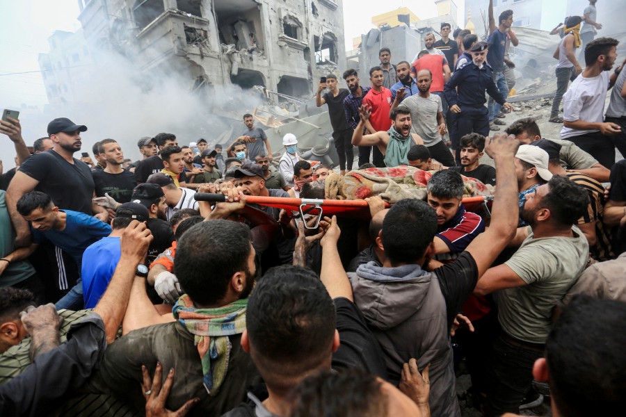 People carry the body of a Palestinian killed in Israeli strikes, in Jabalia refugee camp, in the northern Gaza Strip. - REUTERS PIC