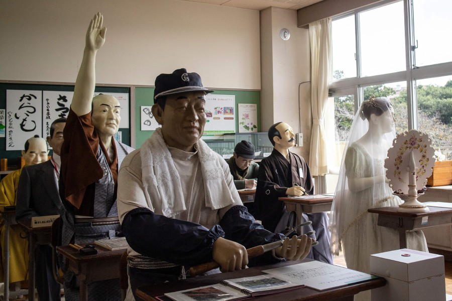 Mannequins dressed and designed as Japanese historical figures on display at a sweet potato museum created inside a classroom at a former elementary school in Namegata, Ibaraki Prefecture. - AFP PIC