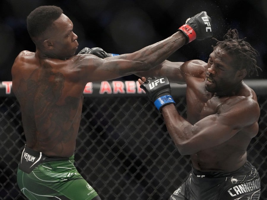  Israel Adesanya (lefts) and Jared Cannonier ight in a bout during UFC 276 at T-Mobile Arena in Las Vegas. - REUTERS PIC