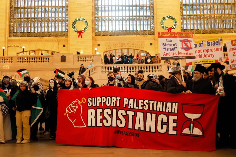 Pro-Palestine activists gather in Grand Central Station as they participate in a Global Strike for Gaza on December 18, 2023 in New York City, New York. - AFP PIC