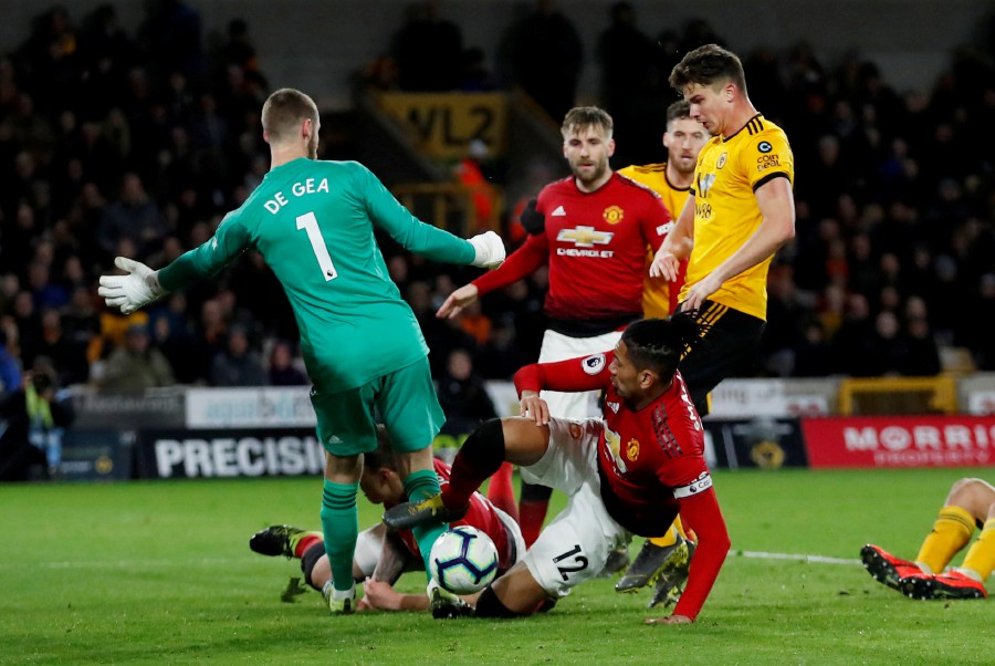  Manchester United's Chris Smalling scores an own goal and the second for Wolverhampton Wanderers. - Reuters