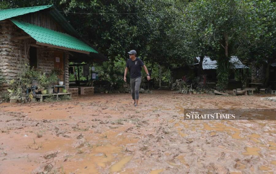 The hillside campsite is currently covered with mud following the water surge in Sungai Batu, Bukit Kachi, Sintok. - NSTP`/SYAHARIM ABIDIN
