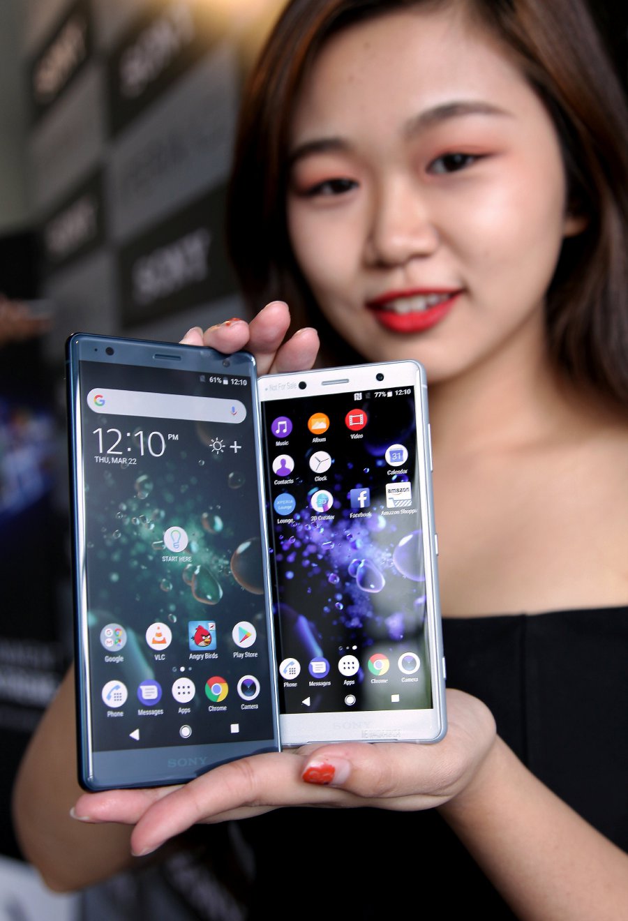 Model Venus Tan showing the new Sony Xperia XZ2 (left) and XZ2 Compact at a launch today. Pix by Nik Hariff Hassan