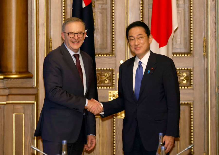 Australian Prime Minister Anthony Albanese (L) and Japanese Prime Minister Fumio Kishida shake hands during a bilateral meeting at the Akasaka Palace state guest house in Tokyo, Japan, 24 May 2022, on the sidelines of the Quad leaders' summit, between the United States, Japan, India and Australia. - EPA PIC