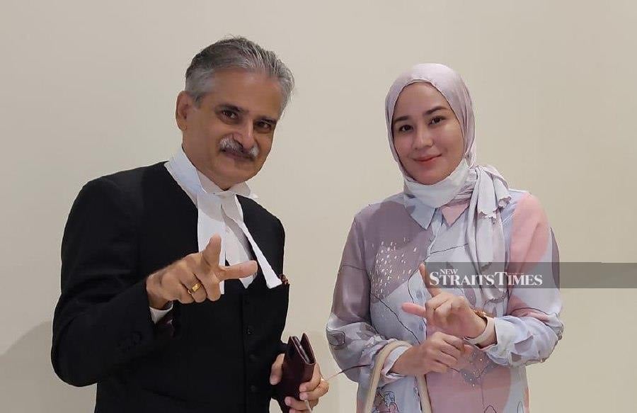 Etiqah Siti Nor Ashikeen Mohd Sulong (right) with her counsel. -Pic courtesy of Rakhbir Singh.