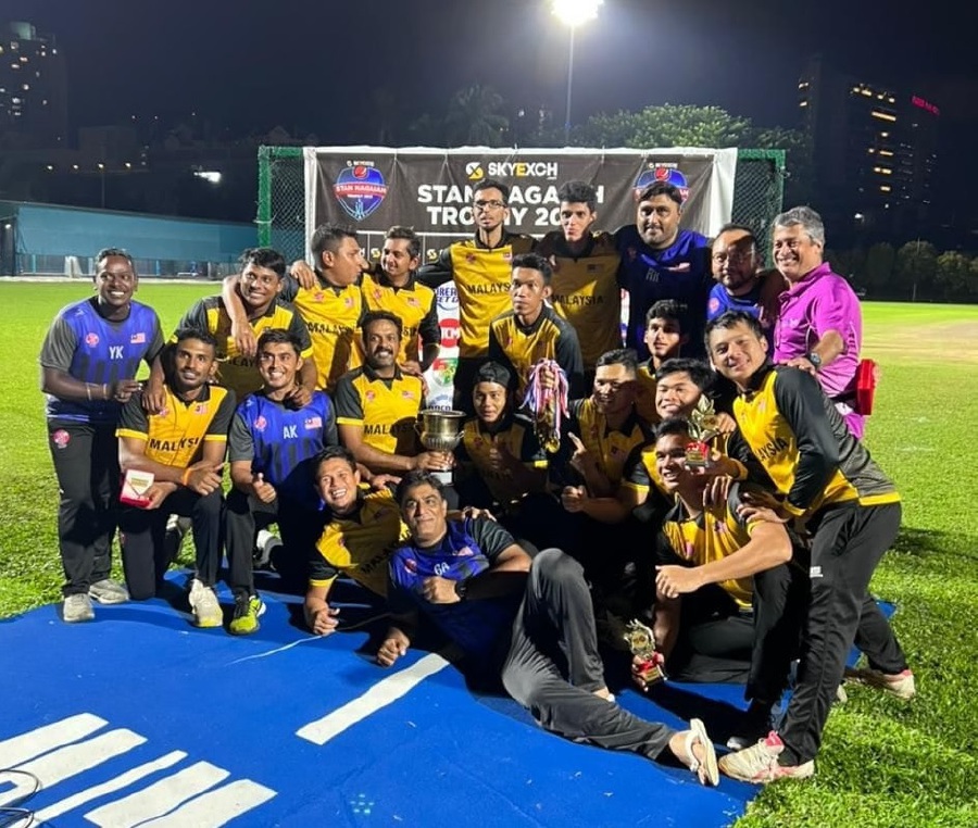 The Malaysian national team pose with the Stan Nagaiah Trophy after beating Singapore 2-1 in a T20I series at the Singapore Indian Association ground on Thursday. Pic courtesy of the Malaysian Cricket Association