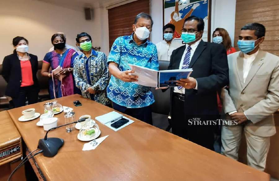 State Tourism, Culture, and Environment Assistant Minister cum Sabah Tourism Board (STB) chairman Datuk Joniston Bangkuai receiving proposal paper to promote Hindu temples in Sabah as tourist attraction from Sabah Chapter Malaysia Hindu chairman Datuk Dr K. Mathavan, on Thursday. - Pic courtesy of STB