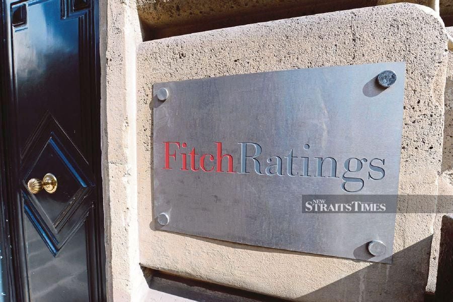 A picture shows the entrance of Fitch ratings agency. (Photo by MIGUEL MEDINA / AFP)