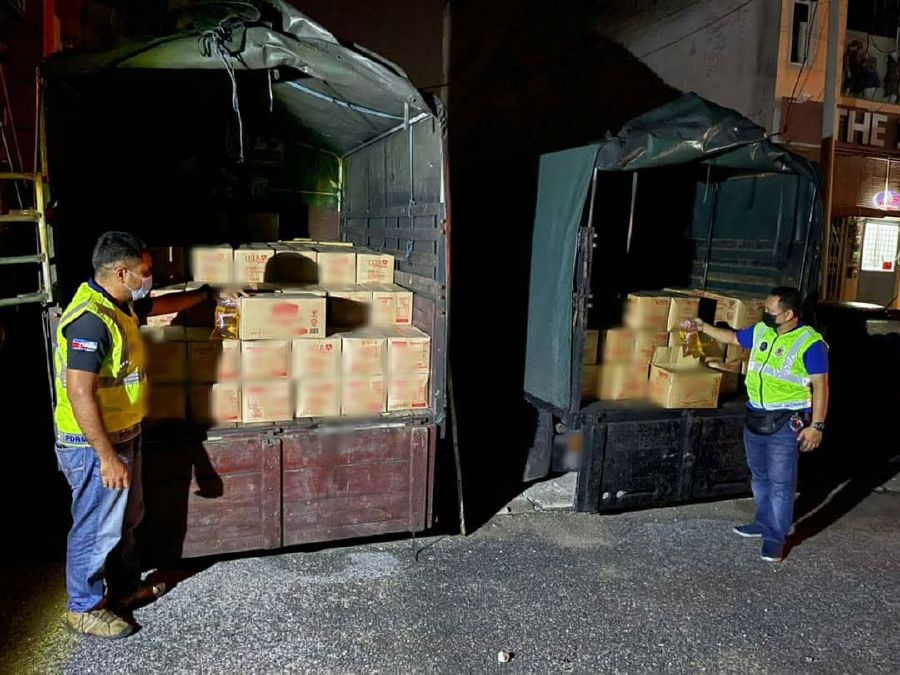 Two lorry drivers were detained for smuggling 5.4 metric tonnes of cooking oil yesterday. - NSTP/  courtesy of Domestic Trade and Consumer Affairs Ministry