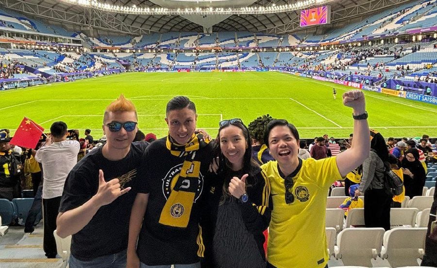 Derrick Gan (left) with his cousins at the AFC Asian Cup in Qatar recently. - Pic credit Facebook/Derrick Gan 