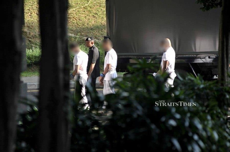 The suspects in the murder case of Deputy Public Prosecutor Kevin Morais were brought to court to hear the outcome of their appeal at the Putrajaya Court. - NSTP pic