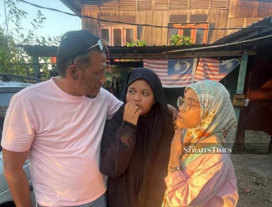 ALOR SETAR: Sofan Feroza Md Yusof (Left) reunited with his daughter, Sofea Auni Adila, 14, who was found safe after she went missing since Tuesday (Feb 27). — NSTP PIC 