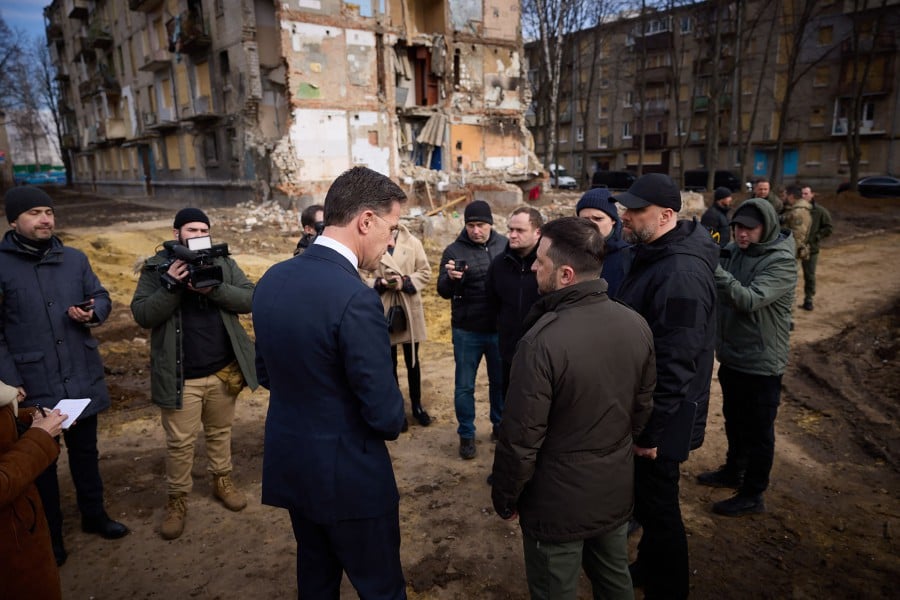 Ukrainian President Volodymyr Zelenskyy (R) and Prime Minister of the Netherlands Mark Rutte (C) inspecting damaged buildings in Kharkiv, amid the Russian invasion of Ukraine. - AFP PIC