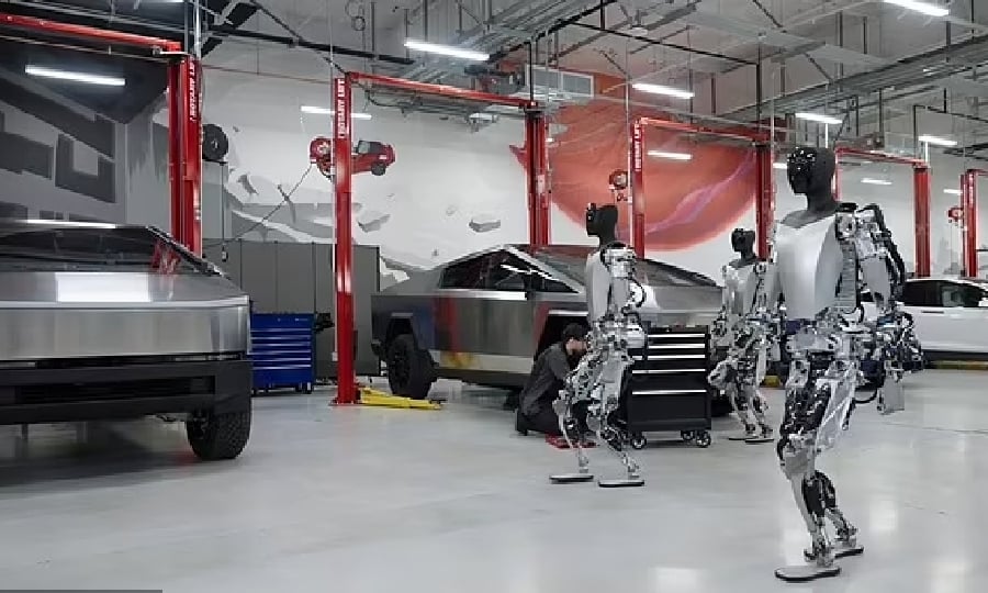 This screengrab from Tesla’s YouTube channel shows robots at one of its factory.