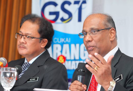 Customs Department GST Director Datuk Subromaniam Tholasy (right) says 30 businesses have been identified for imposing GST without valid GST registration. File pic.