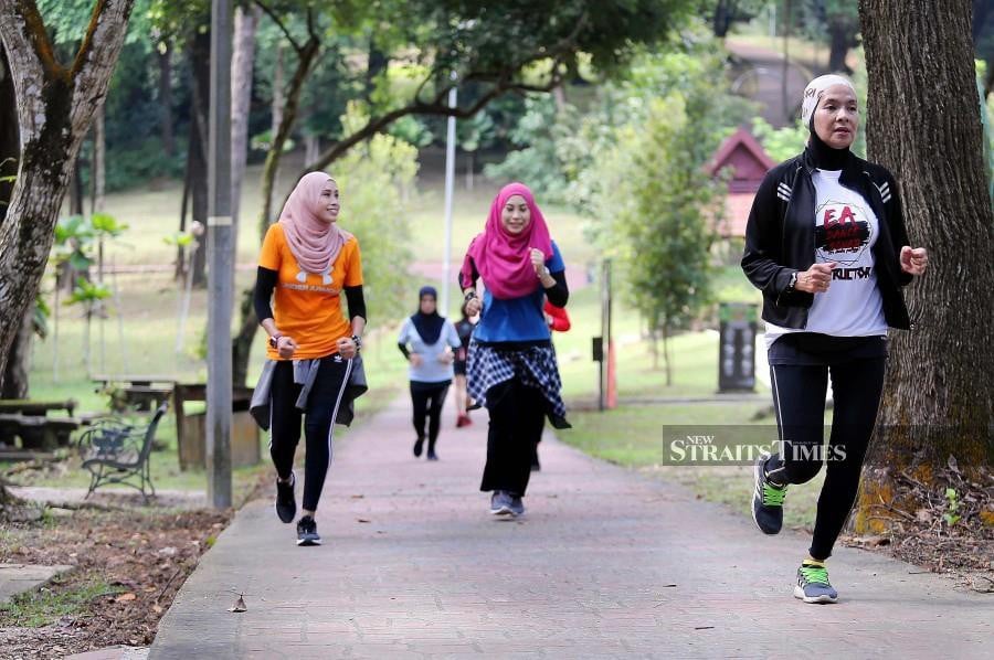Joggers at Taman Tasik Permaisuri, Kuala Lumpur, today. NSTP/SAIFULLIZAN TAMADI.