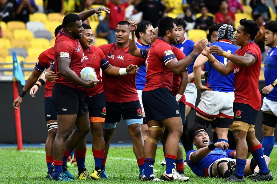 Malaysia managed to get only one try through Timoci Vunimoku (far left) in the 33d minute for five points and a penalty (3 points) in the last minute through Rosmanizam Roslan.