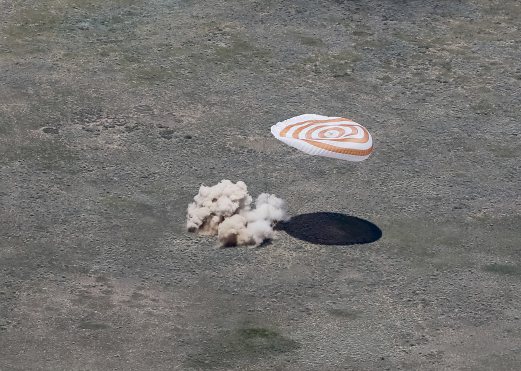 The Soyuz TMA-19M capsule carrying NASA's Tim Kopra, Tim Peake of the European Space Agency and Russian agency Roscosmos' Yuri Malenchenko lands near the town of Dzhezkazgan, Kazakhstan, Saturday, June 18, 2016. A three-person crew from the International Space Station has landed safely in the sun-drenched steppes of Kazakhstan. Shamil Zhumatov/Pool Photo via AP 