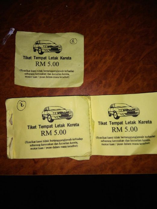 Parking tout asks RM5 from motorist who turns out to be a cop