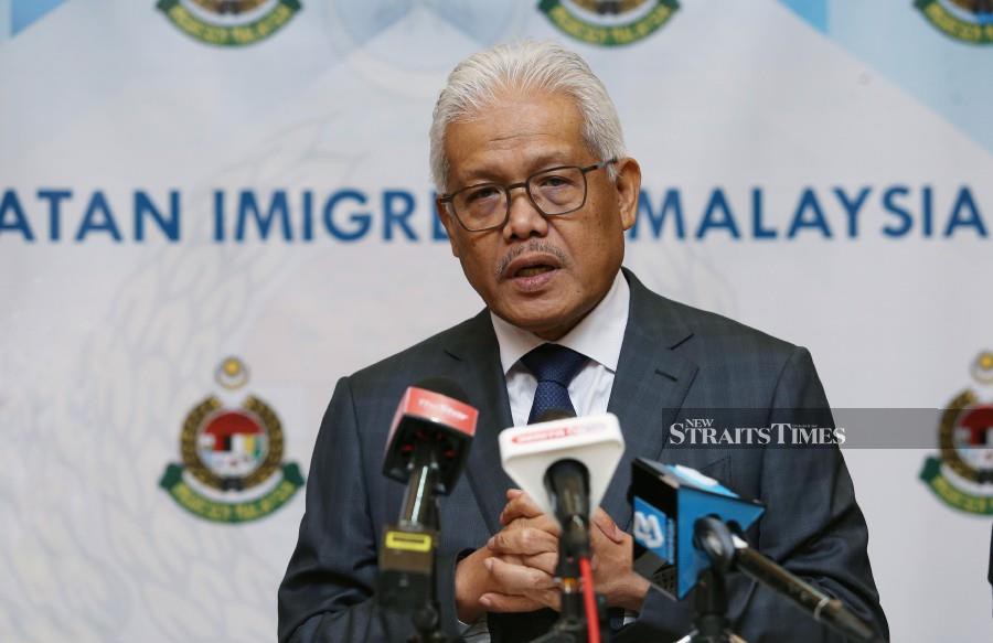 Caretaker Home Minister Datuk Seri Hamzah Zainudin speaking to the media after attending the monthly assembly of the Immigration Department in Putrajaya. - NSTP/ROHANIS SHUKRI