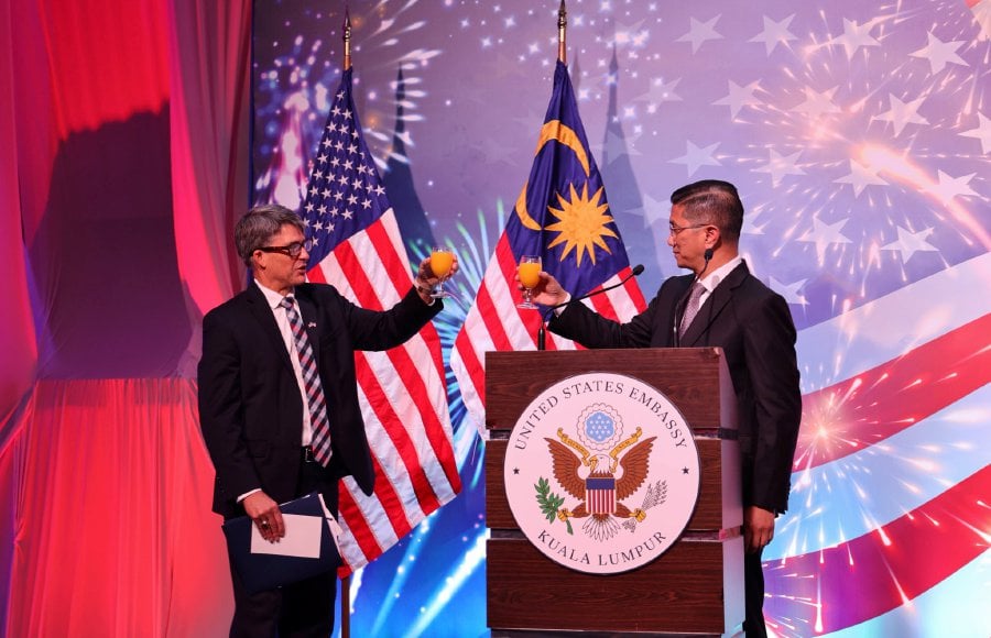US ambassador Brian McFeeters (left) with Malaysia’s Senior International Trade and Industry Minister Datuk Seri Azmin Ali at the 247th US Independence Day reception, held at the Mandarin Oriental Kuala Lumpur, recently. - Pic credit Facebook US Embassy.