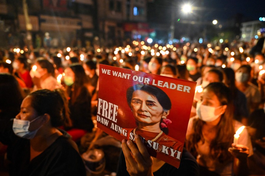  In this file photo taken on March 13, 2021 a protester holds a poster with an image of detained civilian leader Aung San Suu Kyi during a candlelight vigil to honour those who have died during demonstrations against the military coup in Yangon. - AFP PIC