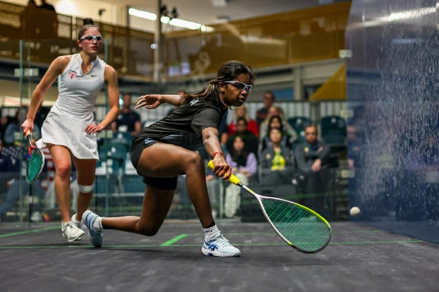 Malaysia’s U. Thanusaa (right) in action against Emma Trauber of the United States in the semi-finals of the World Junior Team Squash Championships in Melbourne on Friday.