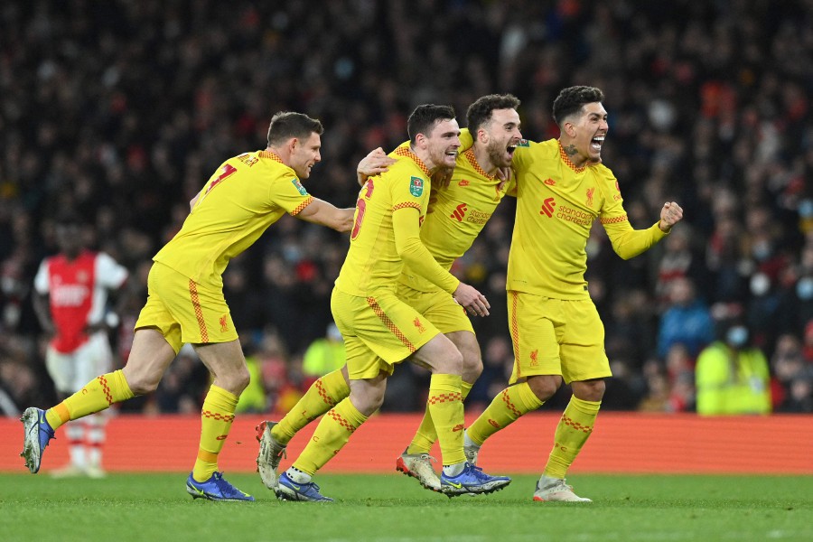 Liverpool's striker Diogo Jota (2nd R) celebrates scoring his team's second goal after a VAR check during the English League Cup semi-final second leg football match between Arsenal and Liverpool at the Emirates Stadium, in London on Jan 20, 2022. -- Pic: AFP
