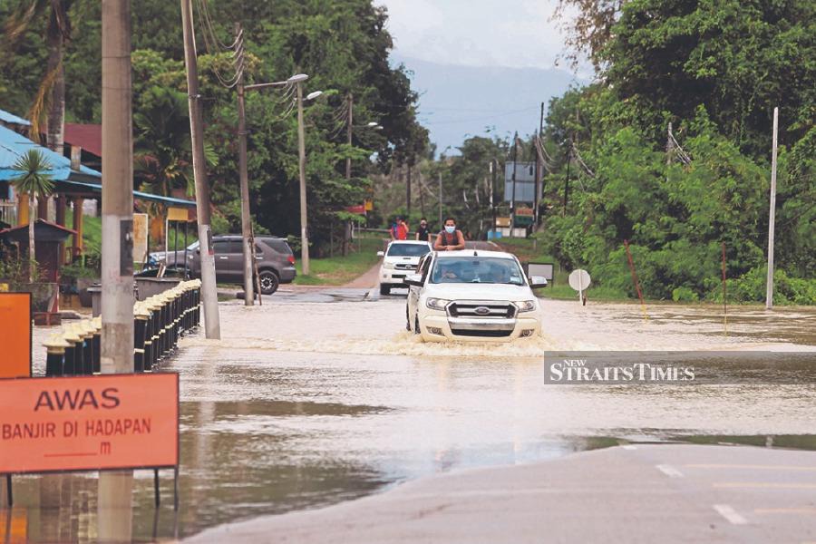 Be extra careful when driving on an inundated road. - FILE PIC
