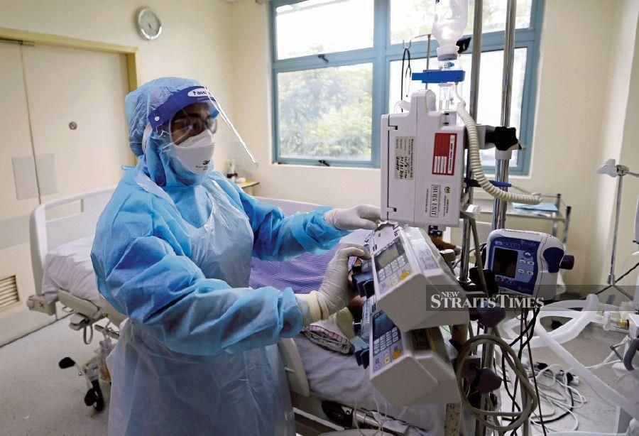 A file pic showing a nurse attending to Covid-19 patient at a hospital in Kuala Lumpur. - NSTP file pic
