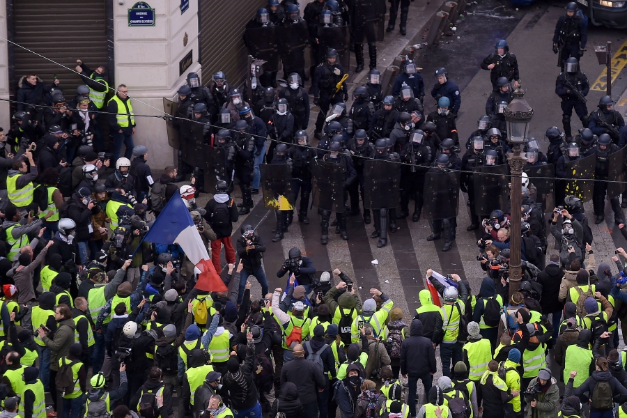 French Police Clash With Yellow Vest Protesters On Champs