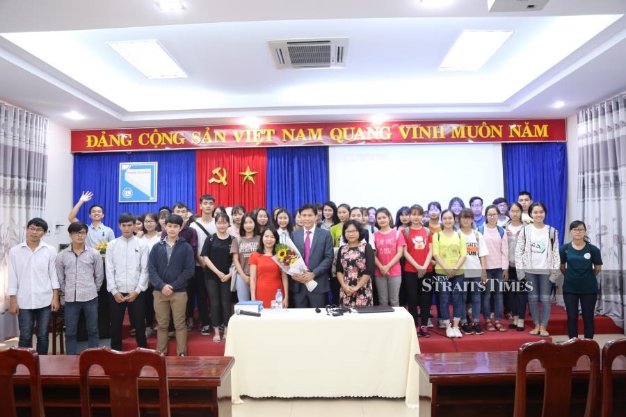  Vietnam (Danang University). Posing with vice-rector Prof Vo, staff and students.