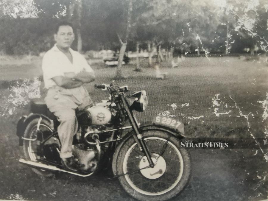  Lat's father,Mohd Khalid Mohd Noh, on his BSA motorbike in Muar, circa 1955.