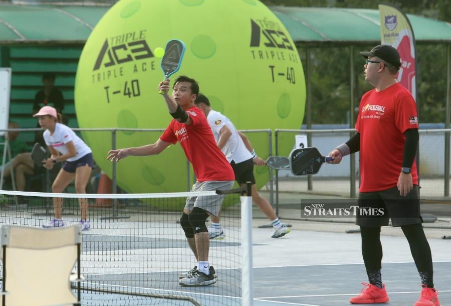  Yap and Jason (right) from Subang Jaya Pickleball team in action.