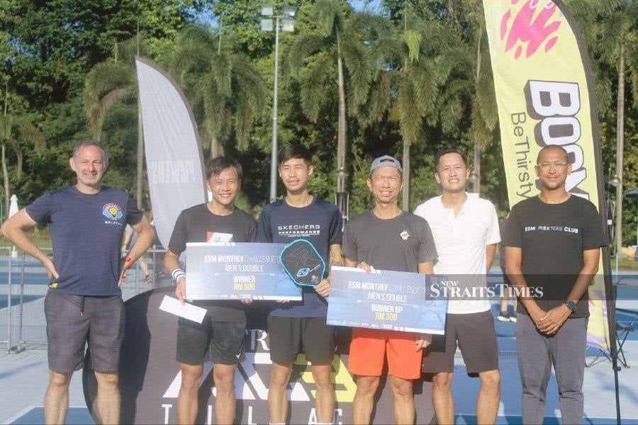  Chen Kian Fong and Colin Wong (second and third from left, respectively), emerged as strong winners of the men's doubles category.