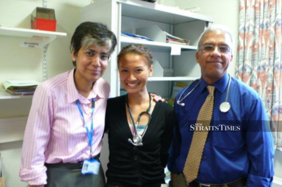  As a young medical intern, with her bosses.