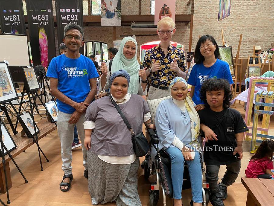  Firdaus at an event with other members of the Malaysian Rare Disorders Society.