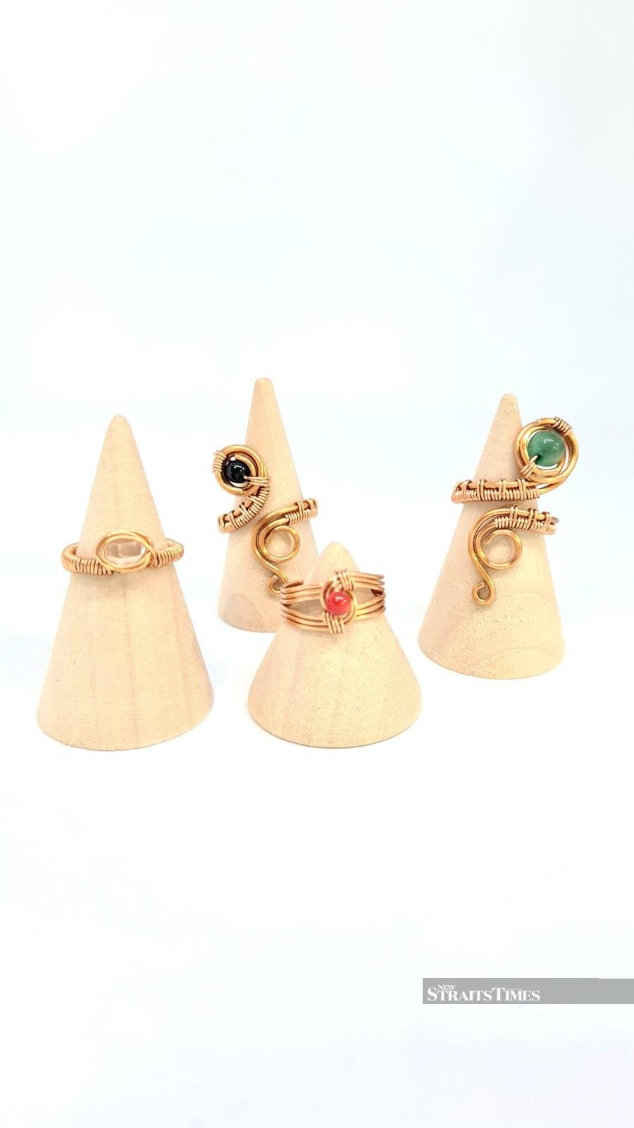  Copper rings with precious gemstones.