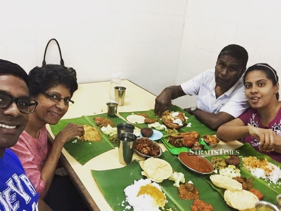 The younger Logesh and his family in Malaysia.