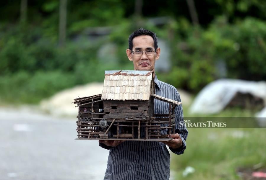 Immortalising Our Disappearing Heritage Through Miniature Wooden Kampung Houses