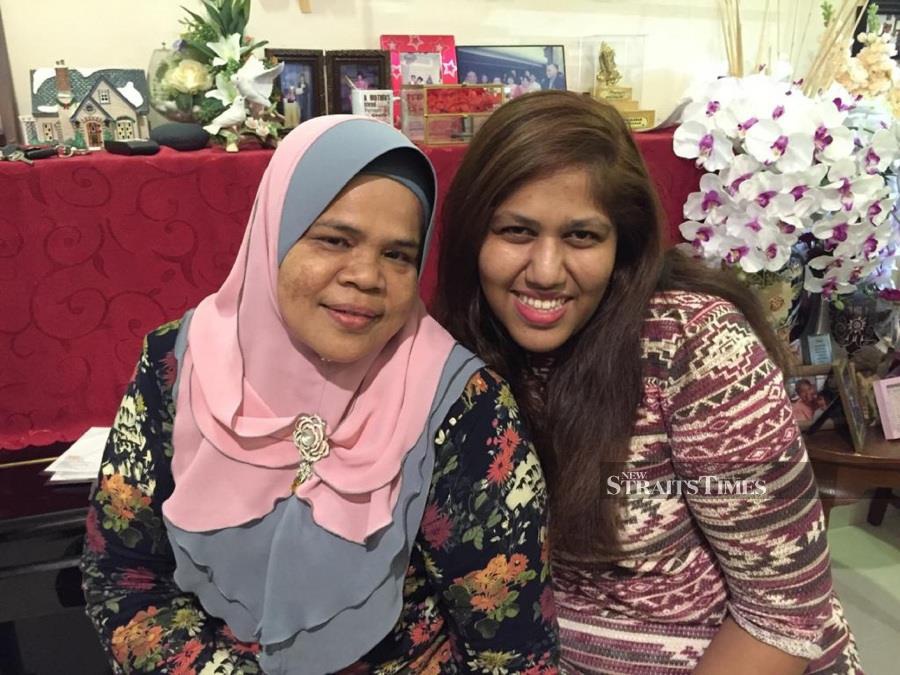  With Cikgu Aishah, her teacher who helped her during her schooling years. Grace has remained lifelong friends with her since then.
